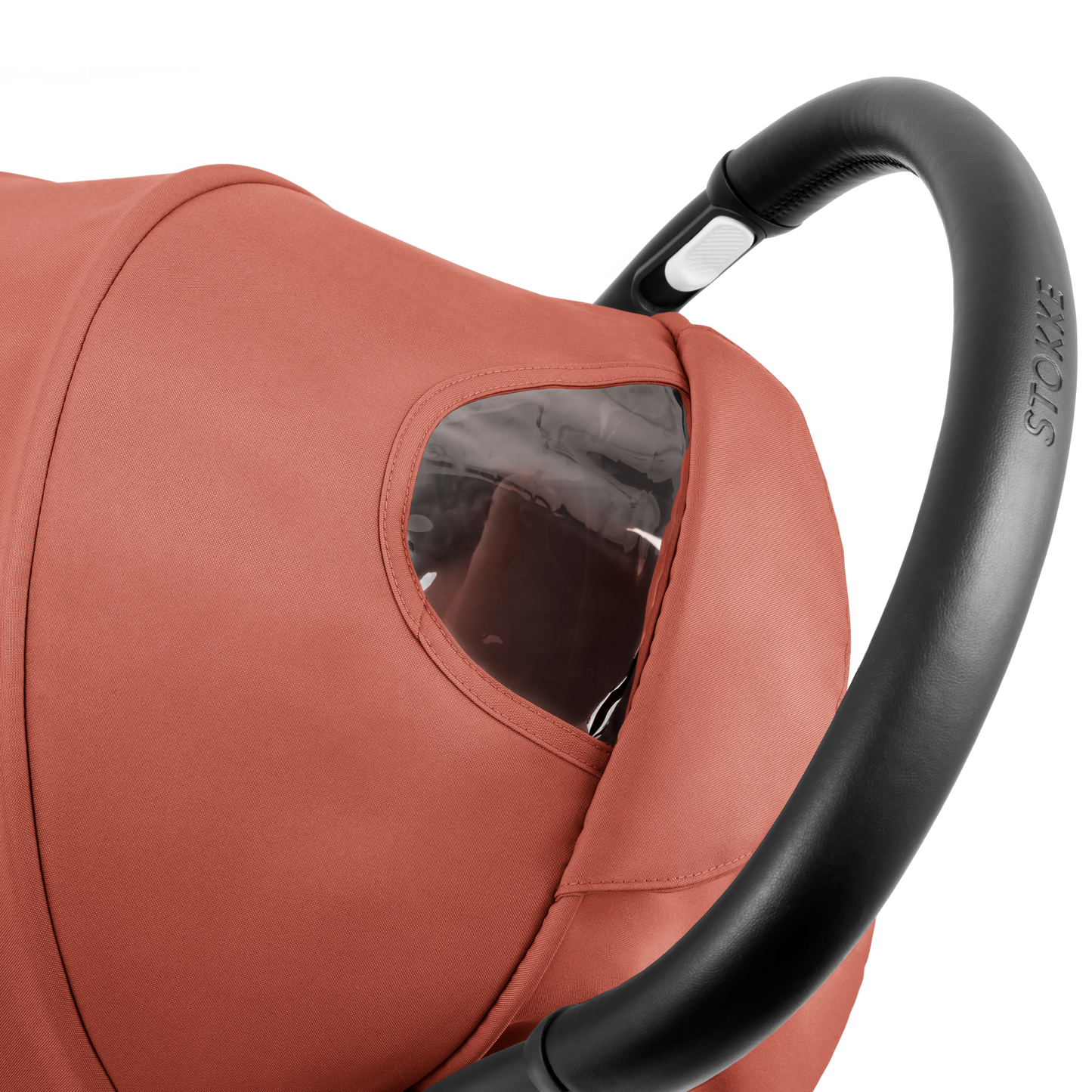 A compact baby stroller with a terracotta canopy and terracotta padded seat, with a blacked out chassis, shown on a plain white background.