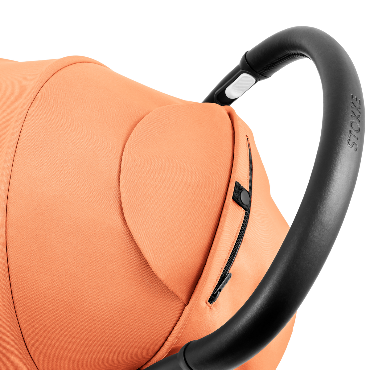 A compact yoyo 5 stroller with a peach orange canopy and seat lining, a black frame, and black wheels, shown on a plain white background.