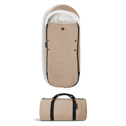 A stroller with a beige colored padded footmuff, cream fleece lining, and a black frame, shown from the front on a white background.