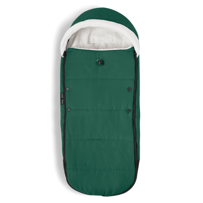 A stroller with a forest green colored padded footmuff, cream fleece lining, and a black frame, shown from the front on a white background.
