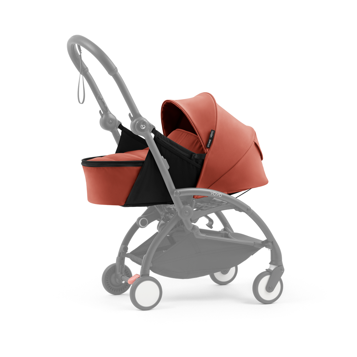 A yoyo stroller bassinet attachment set in terracotta orange and black, shown mounted on a stroller frame against a solid white background.