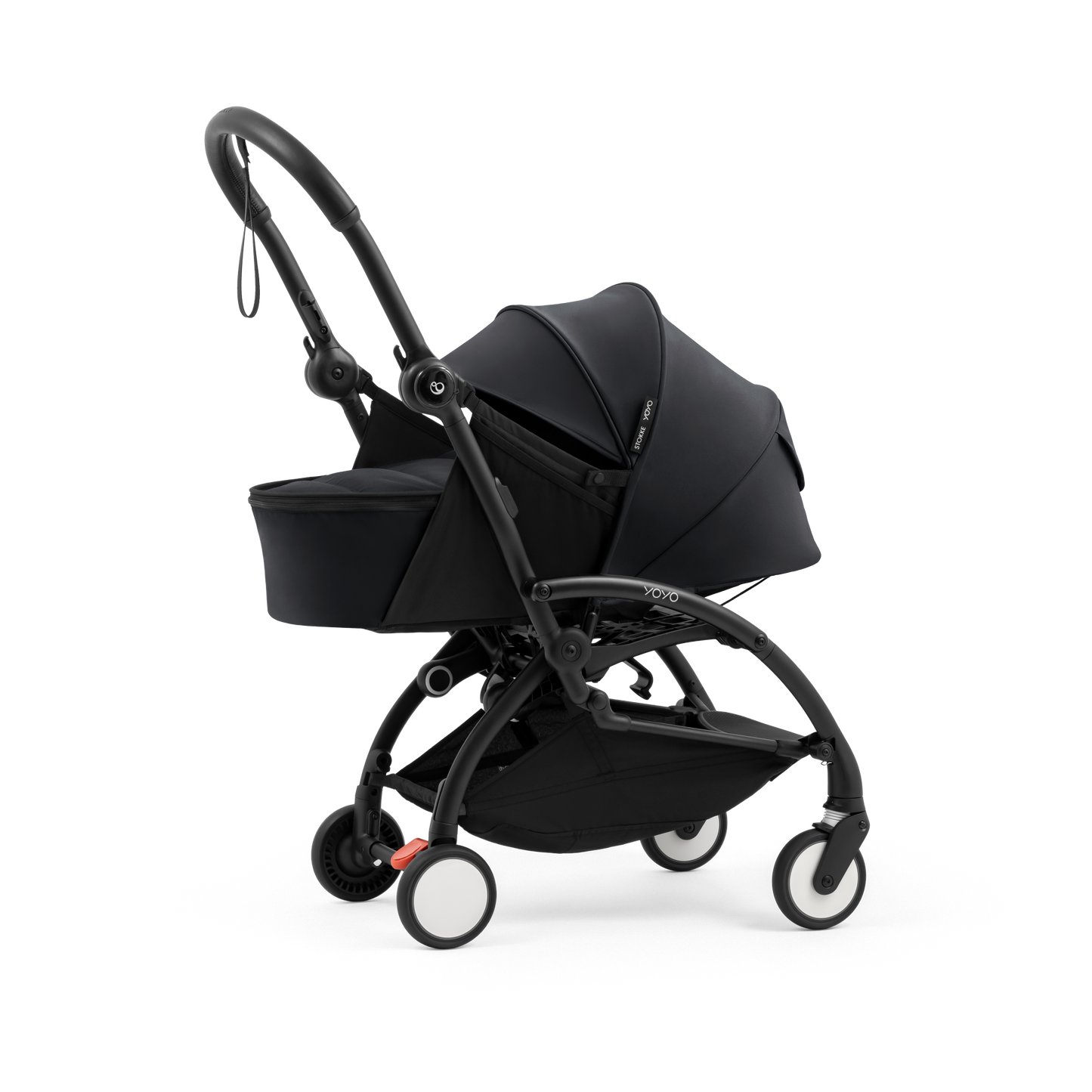 A black stroller newborn travel system shown in black, with a stroller behind it to demonstrate compatibility, on a clean white background.
