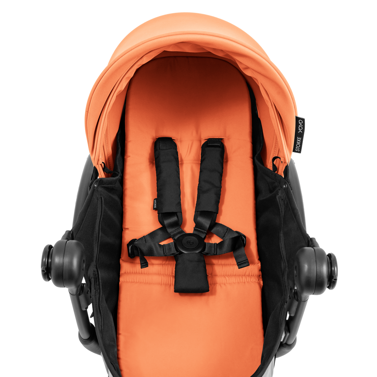 A yoyo stroller bassinet attachment set in orange and black, shown mounted on a stroller frame against a solid white background.