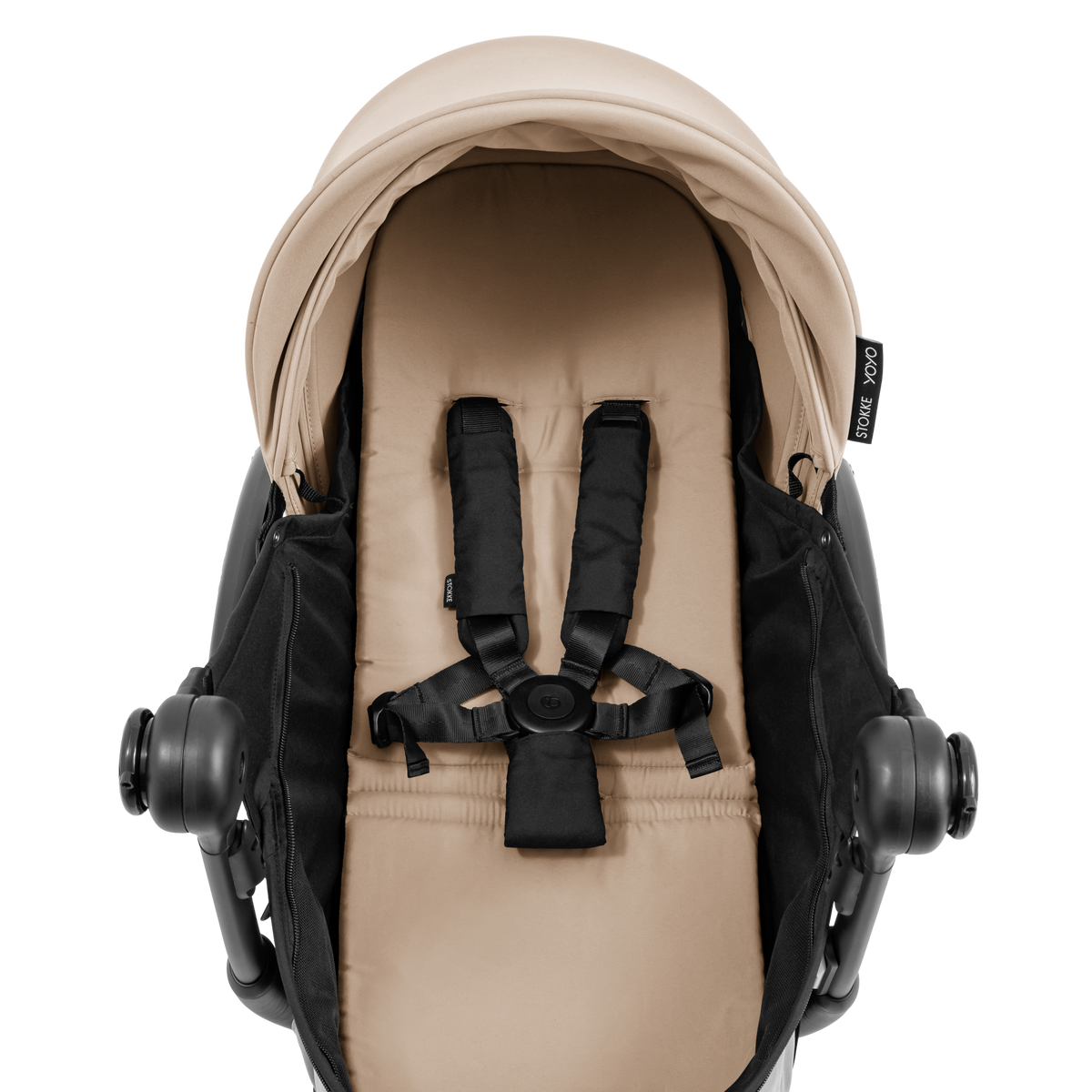 A yoyo stroller bassinet attachment set in beige and black, shown mounted on a stroller frame against a solid white background.