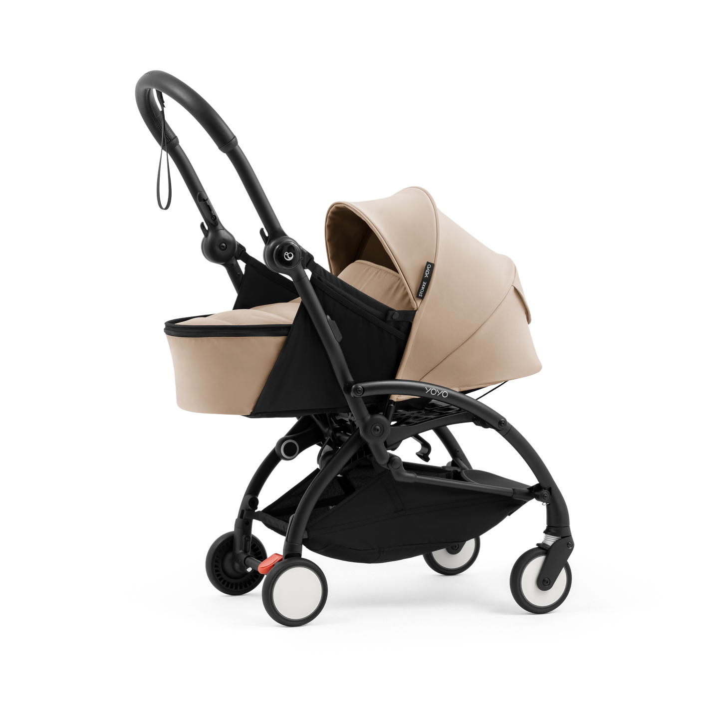 A yoyo stroller bassinet attachment set in beige and black, shown mounted on a stroller frame against a solid white background.