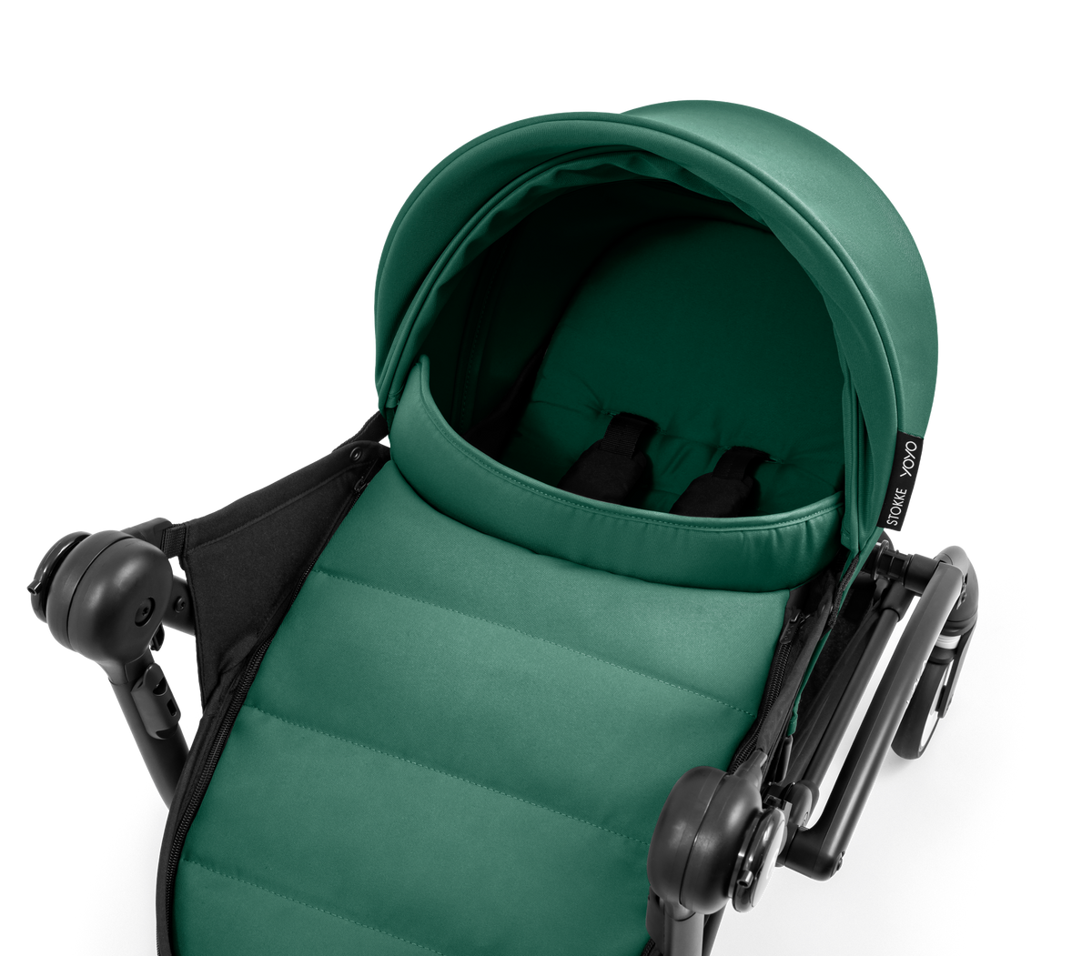 A yoyo stroller bassinet attachment set in dark green and black, shown mounted on a stroller frame against a solid white background.