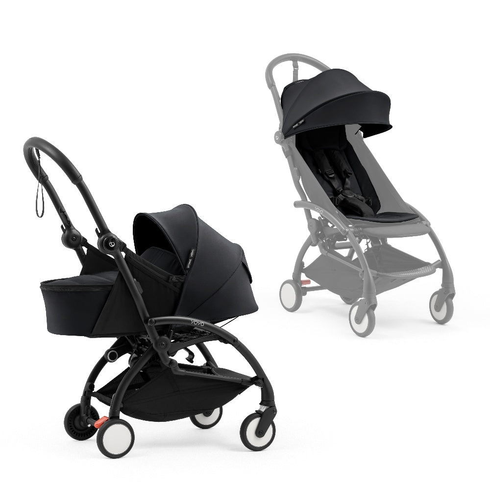A black stroller newborn travel system shown in black, with a stroller behind it to demonstrate compatibility, on a clean white background.