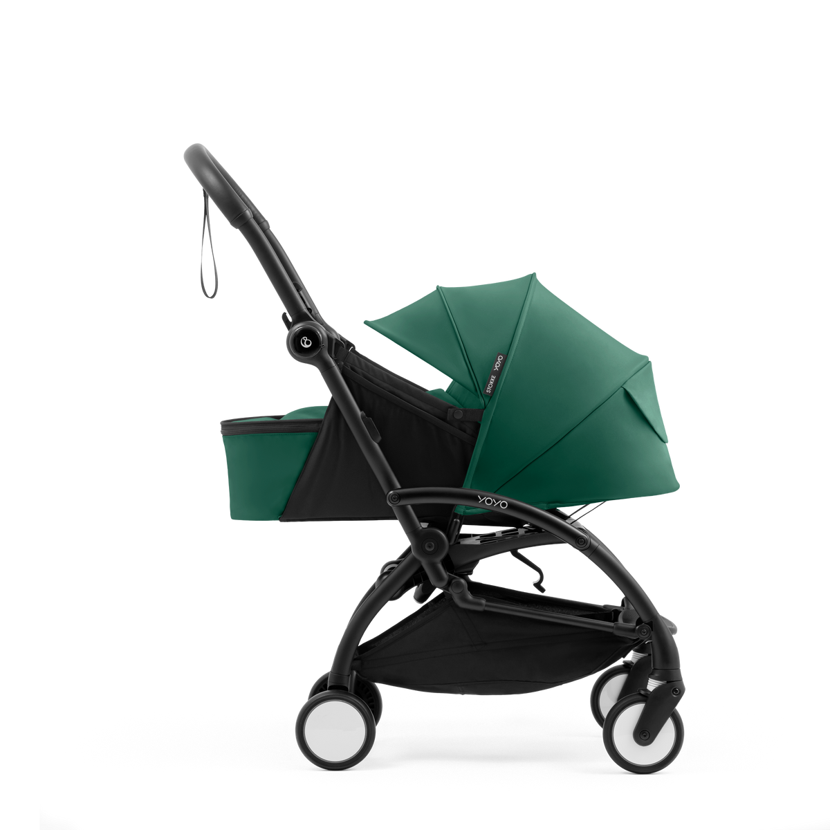 A yoyo stroller bassinet attachment set in dark green and black, shown mounted on a stroller frame against a solid white background.