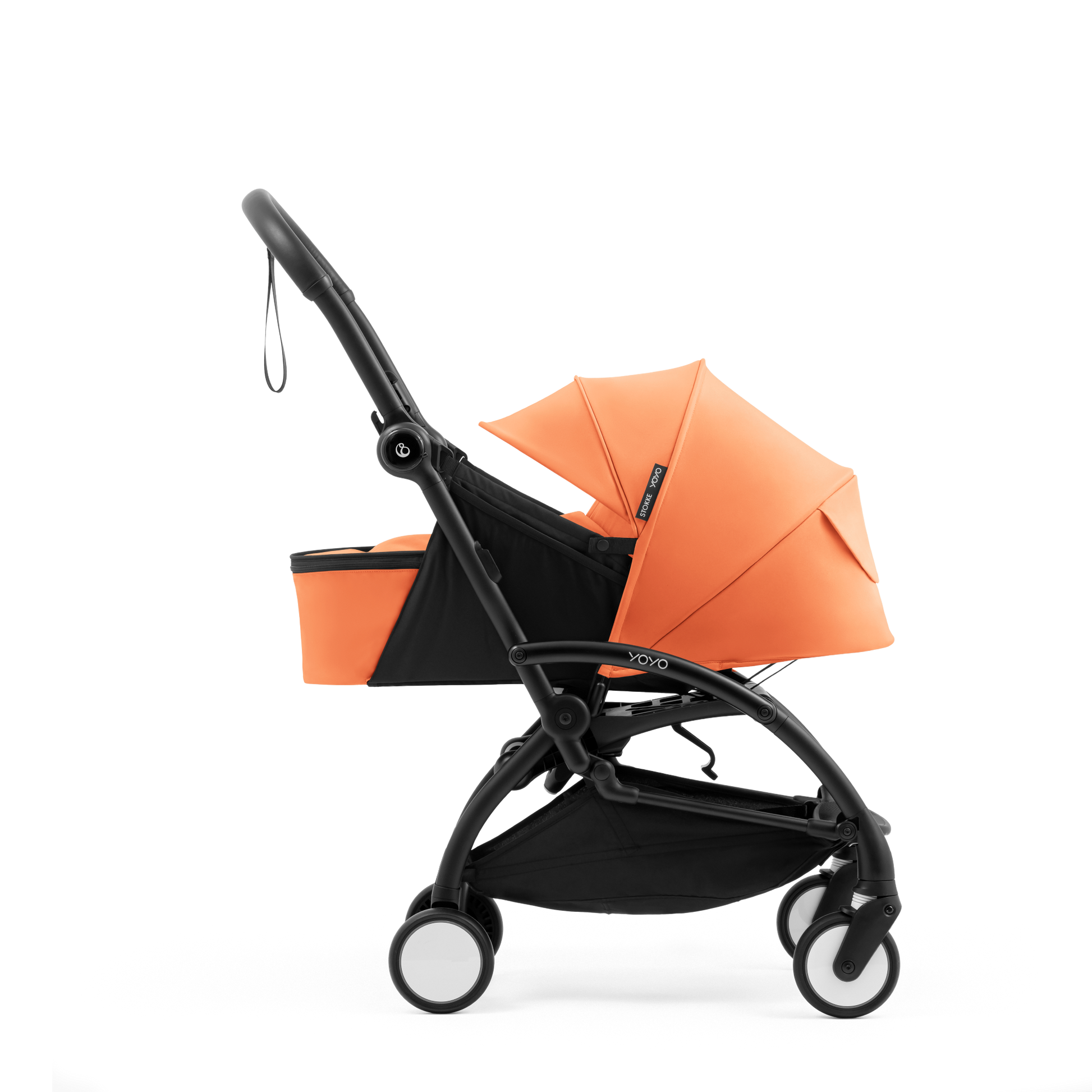 A yoyo stroller bassinet attachment set in orange and black, shown mounted on a stroller frame against a solid white background.