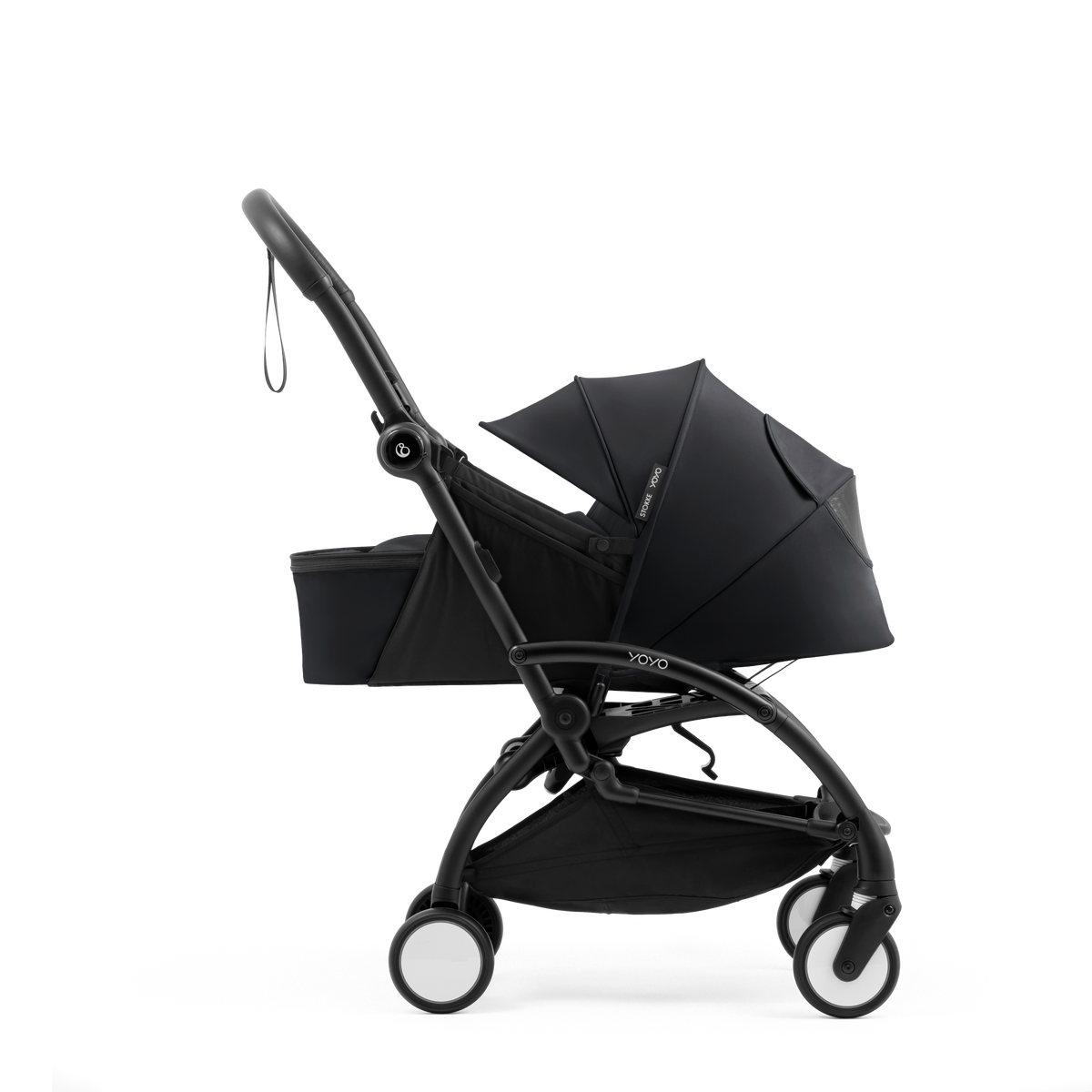 A yoyo stroller bassinet attachment set in black, shown mounted on a stroller frame against a solid white background.