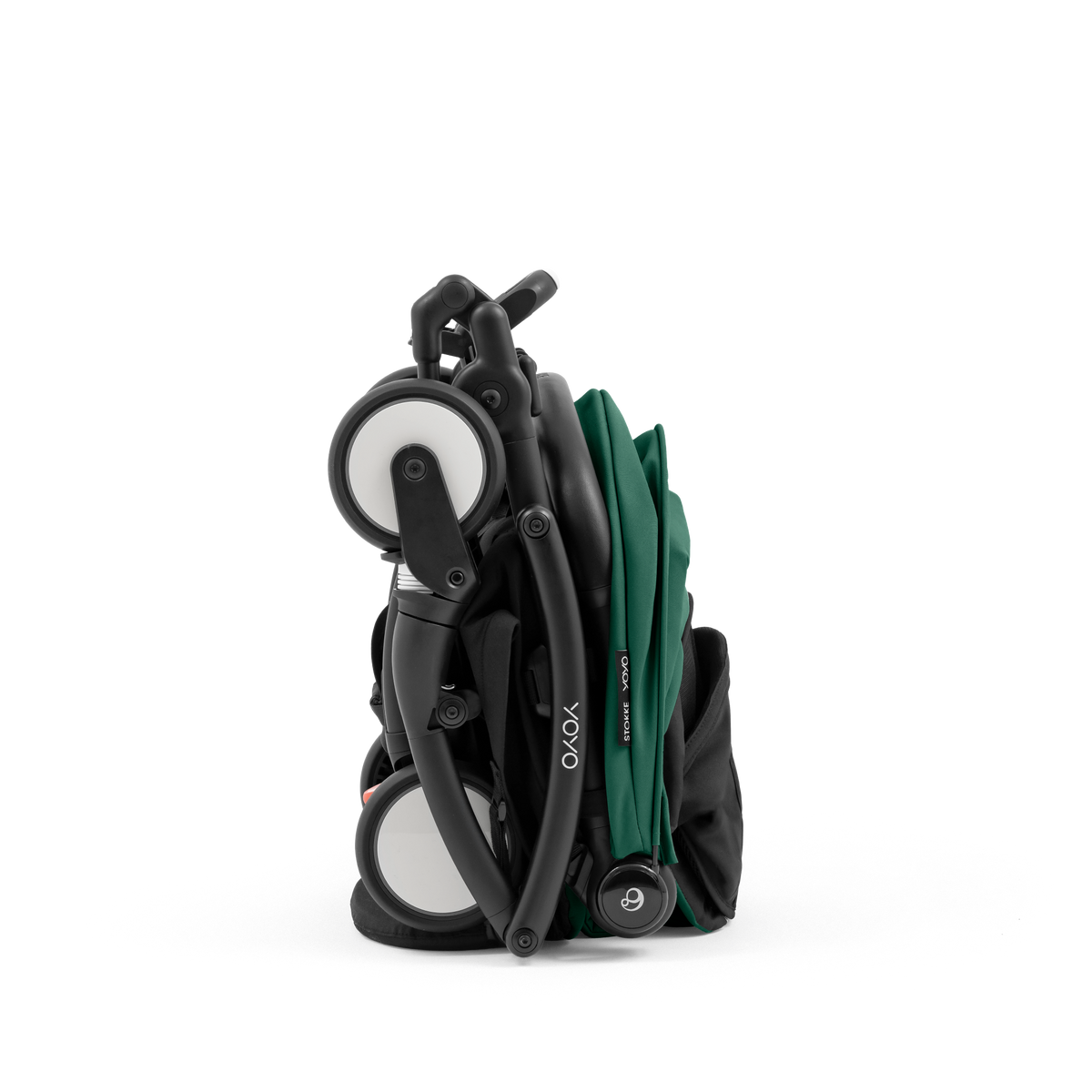 A compact yoyo 5 stroller with a green canopy and seat lining, a black frame, and black wheels, shown on a plain white background.