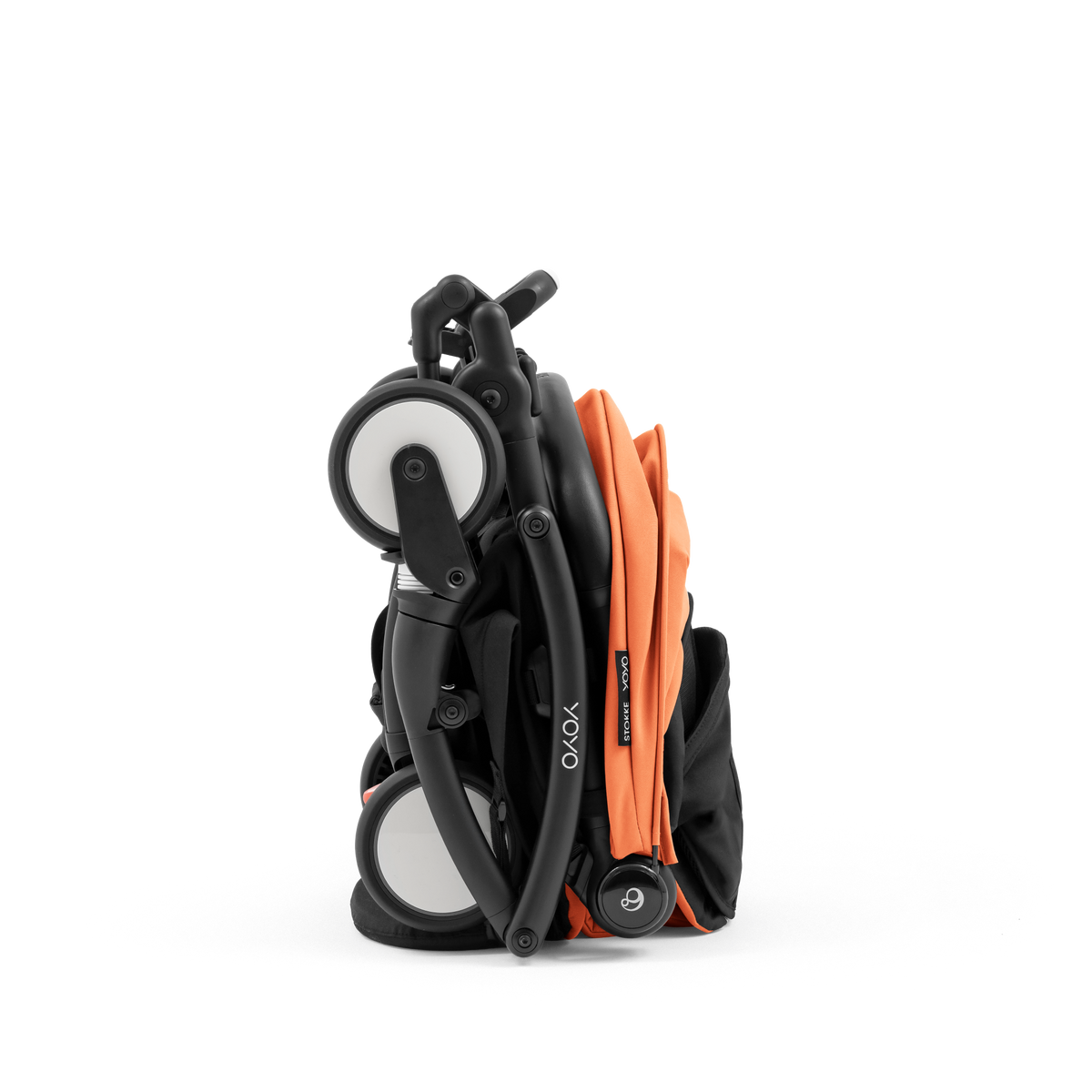 A compact yoyo 5 stroller with a peach orange canopy and seat lining, a black frame, and black wheels, shown on a plain white background.