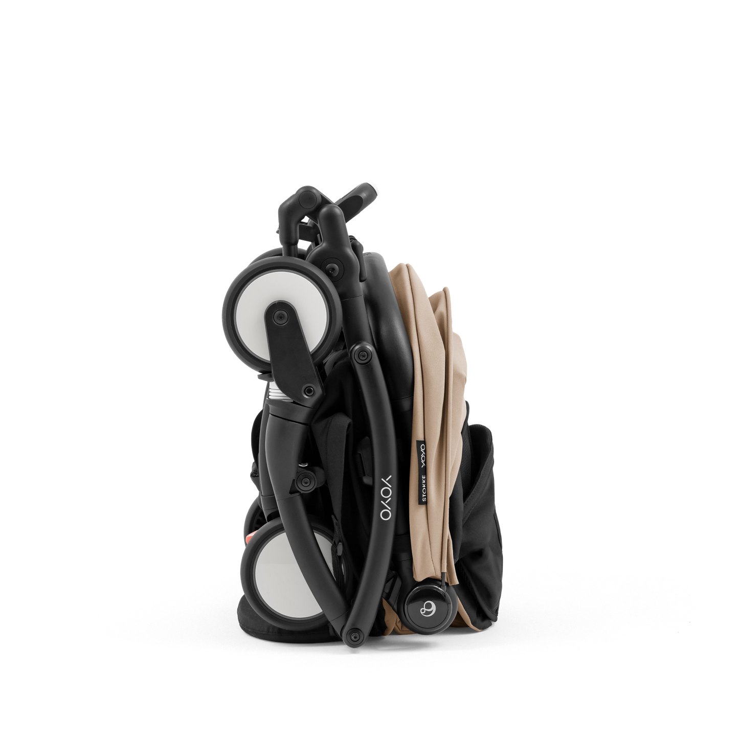 A compact yoyo 5 stroller with a beige canopy and seat lining, a black frame, and black wheels, shown on a plain white background.