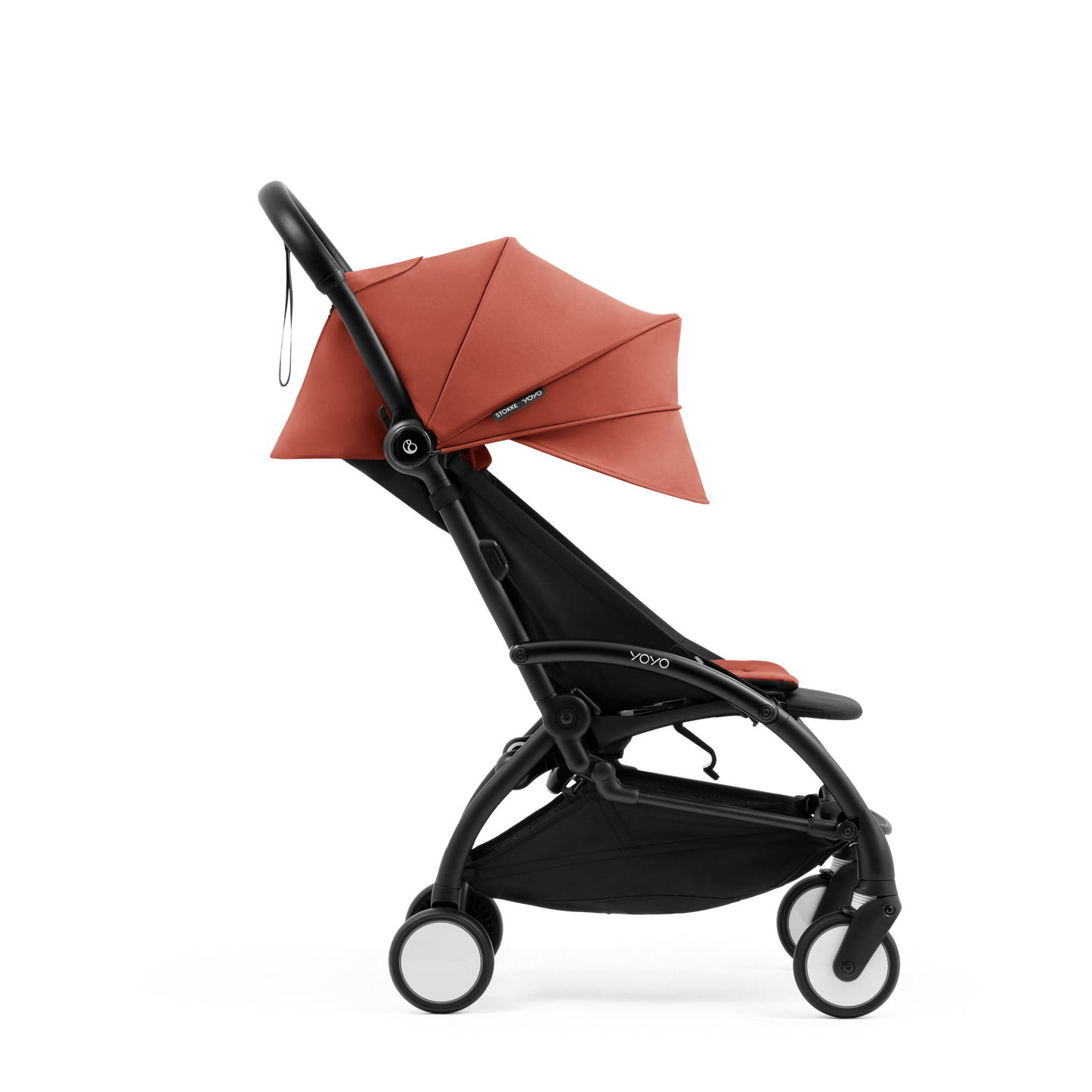 A compact yoyo 5 stroller with a rust-orange canopy and seat lining, a black frame, and black wheels, shown on a plain white background.