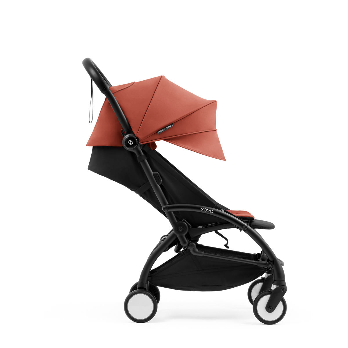 A compact yoyo 5 stroller with a rust-orange canopy and seat lining, a black frame, and black wheels, shown on a plain white background.