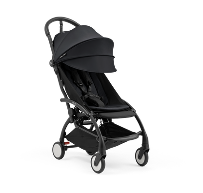 A compact yoyo 5 stroller with a black canopy and seat lining, a black frame, and black wheels, shown on a plain white background.