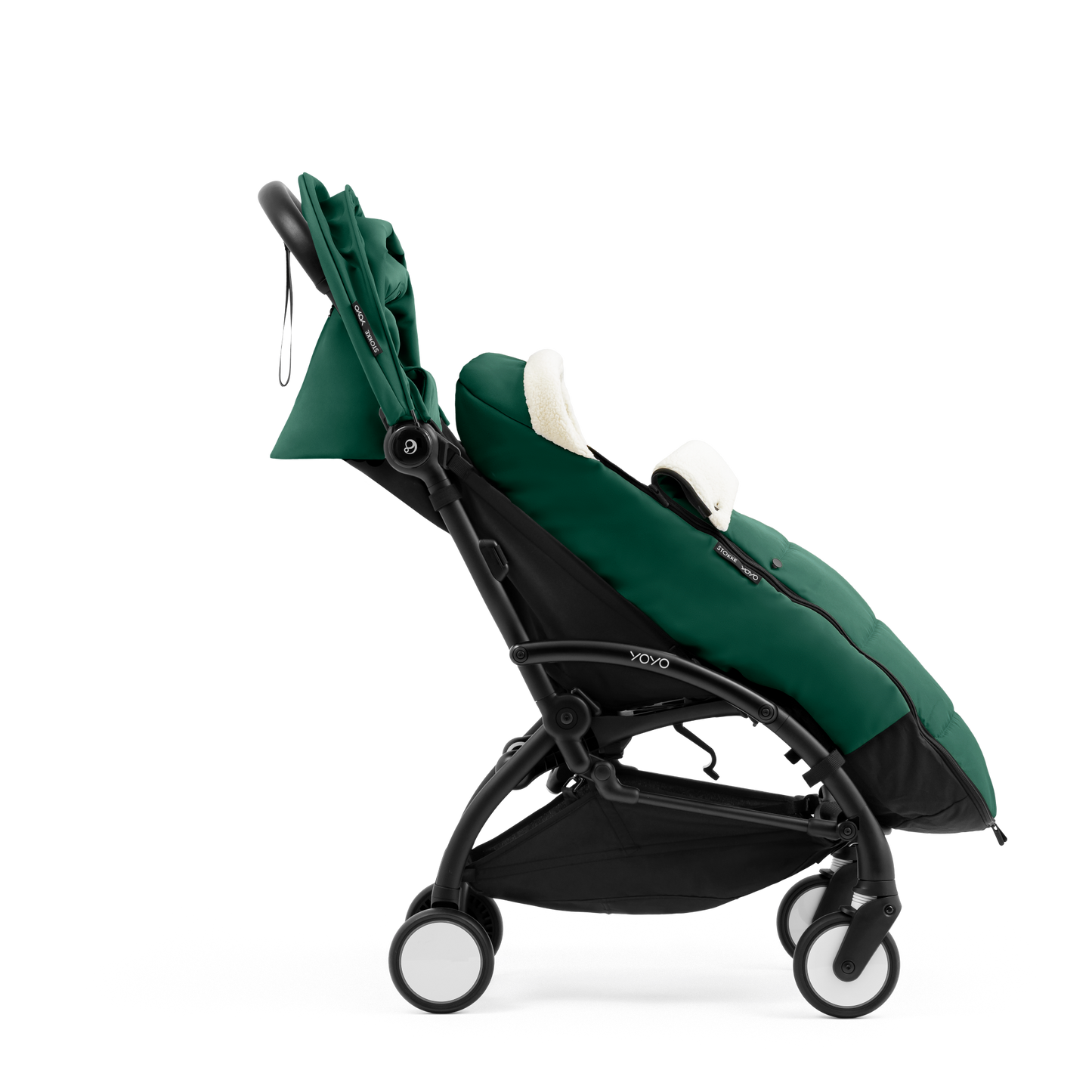 A stroller with a forest green colored padded footmuff, cream fleece lining, and a black frame, shown from the front on a white background.