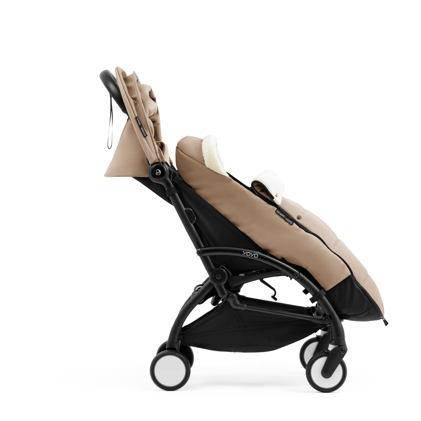 A stroller with a beige colored padded footmuff, cream fleece lining, and a black frame, shown from the front on a white background.