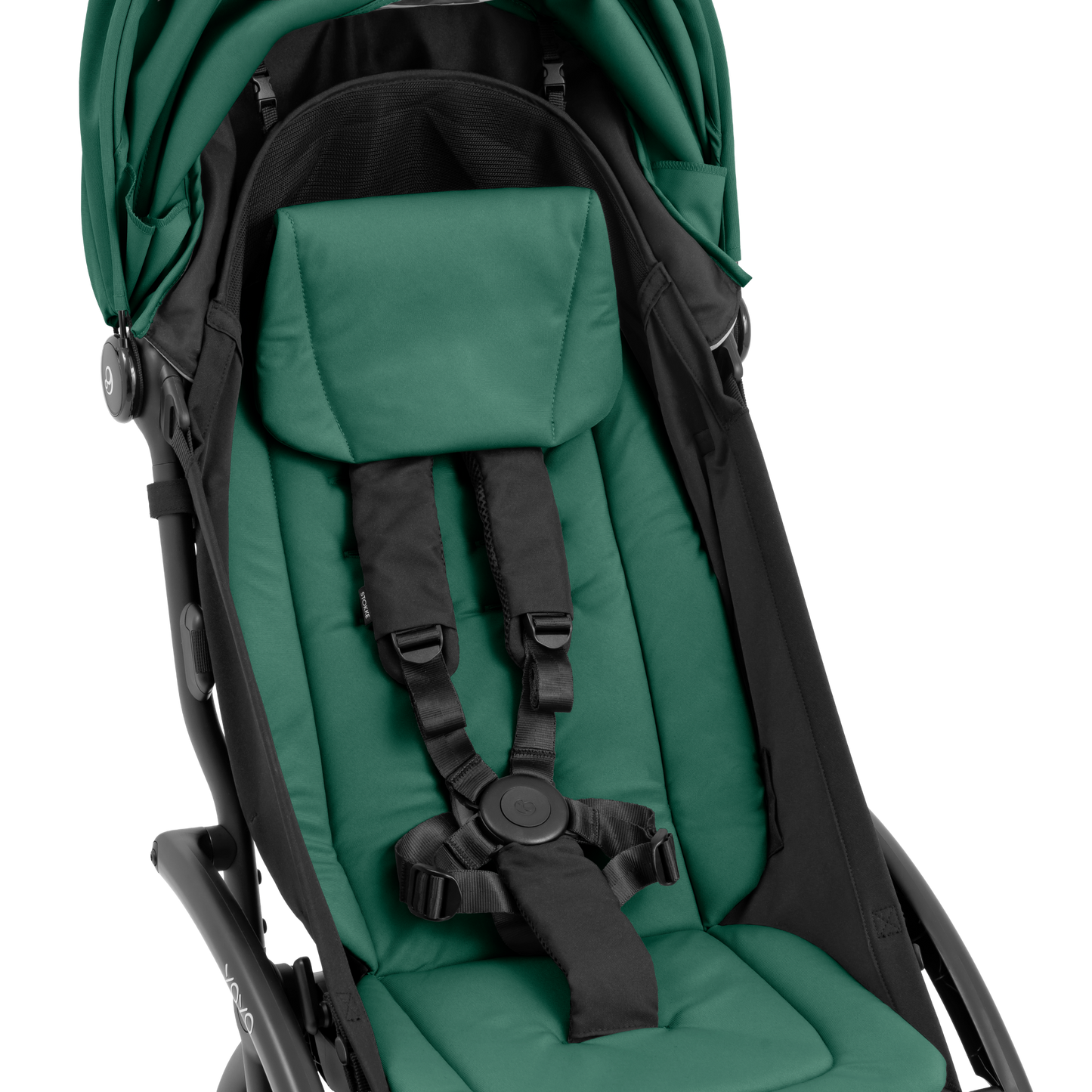 A compact yoyo 5 stroller with a green canopy and seat lining, a black frame, and black wheels, shown on a plain white background.