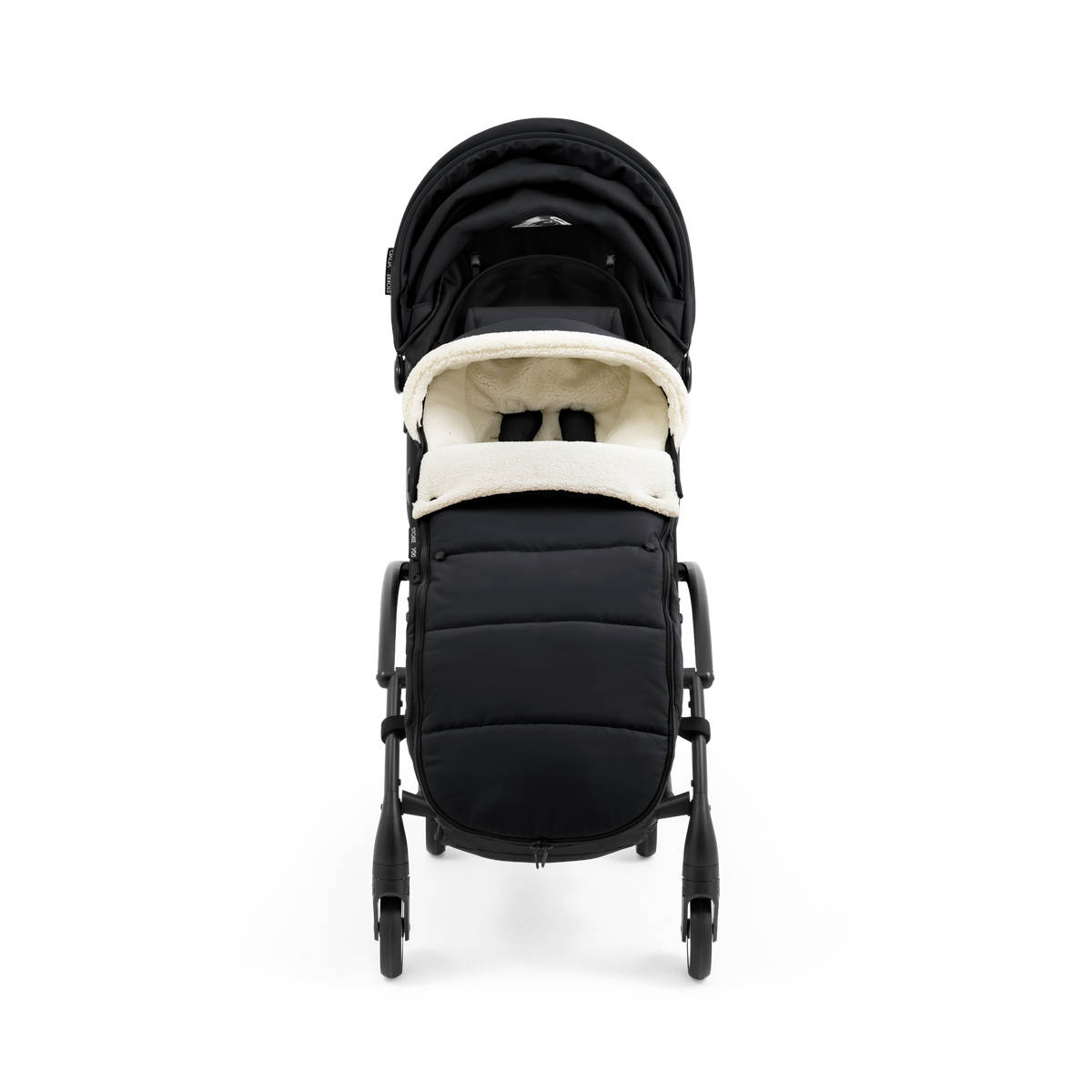 A stroller with a black colored padded footmuff, cream fleece lining, and a black frame, shown from the front on a white background.