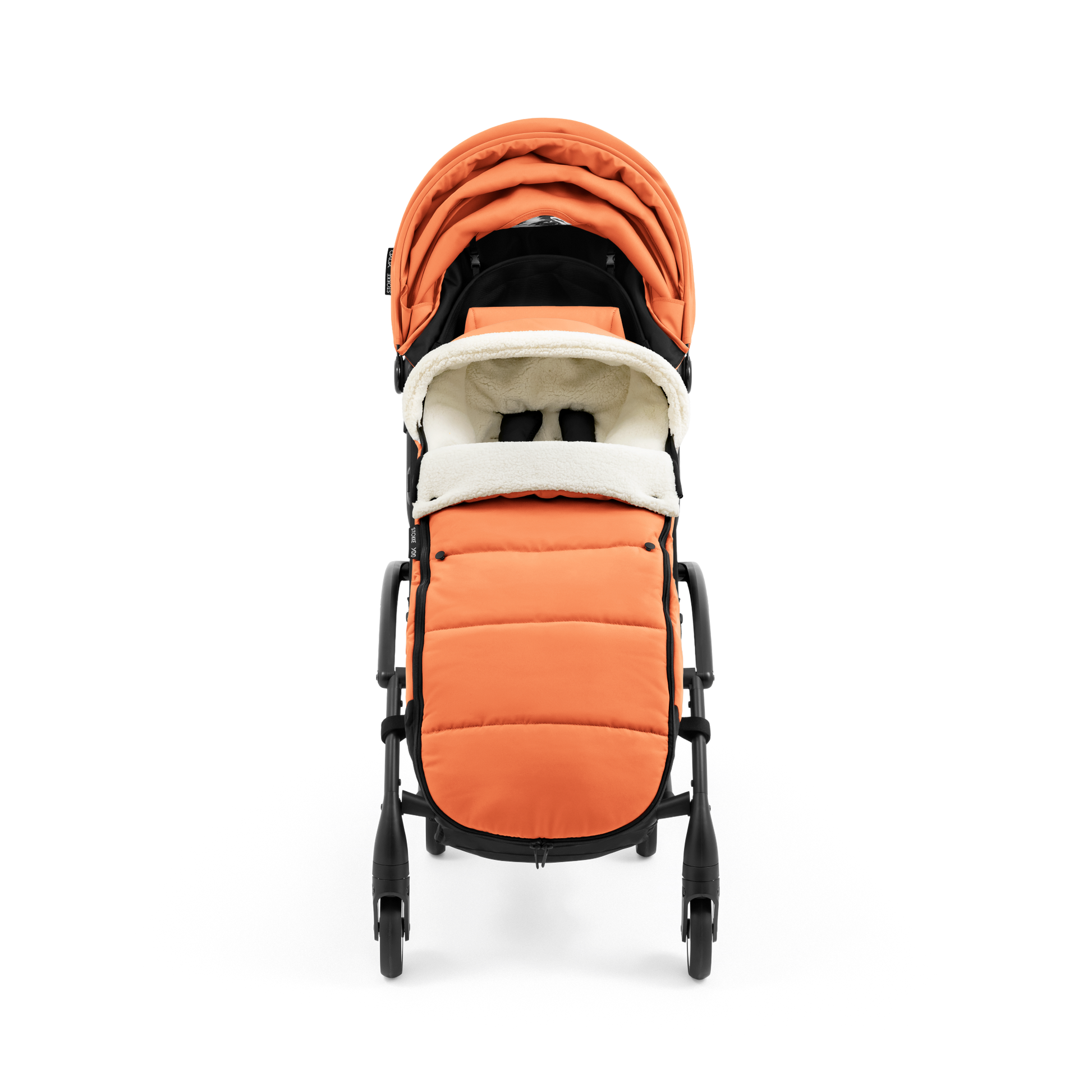 A stroller with a orange colored padded footmuff, cream fleece lining, and a black frame, shown from the front on a white background.