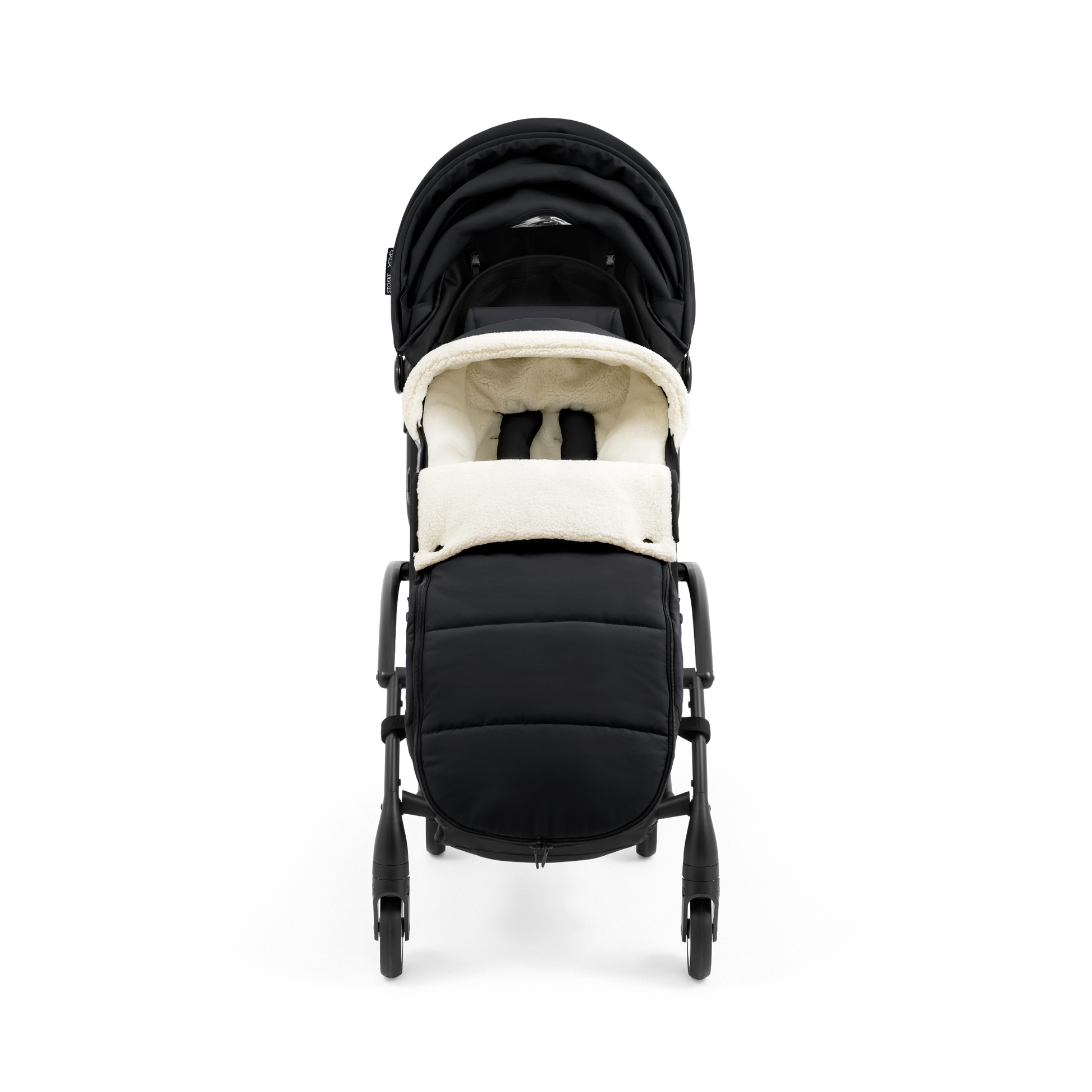 A stroller with a black colored padded footmuff, cream fleece lining, and a black frame, shown from the front on a white background.