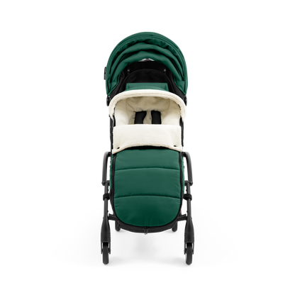 A stroller with a forest green colored padded footmuff, cream fleece lining, and a black frame, shown from the front on a white background.