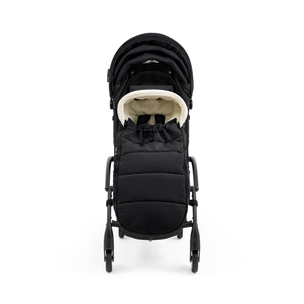 A stroller with a black colored padded footmuff, cream fleece lining, and a black frame, shown from the front on a white background.
