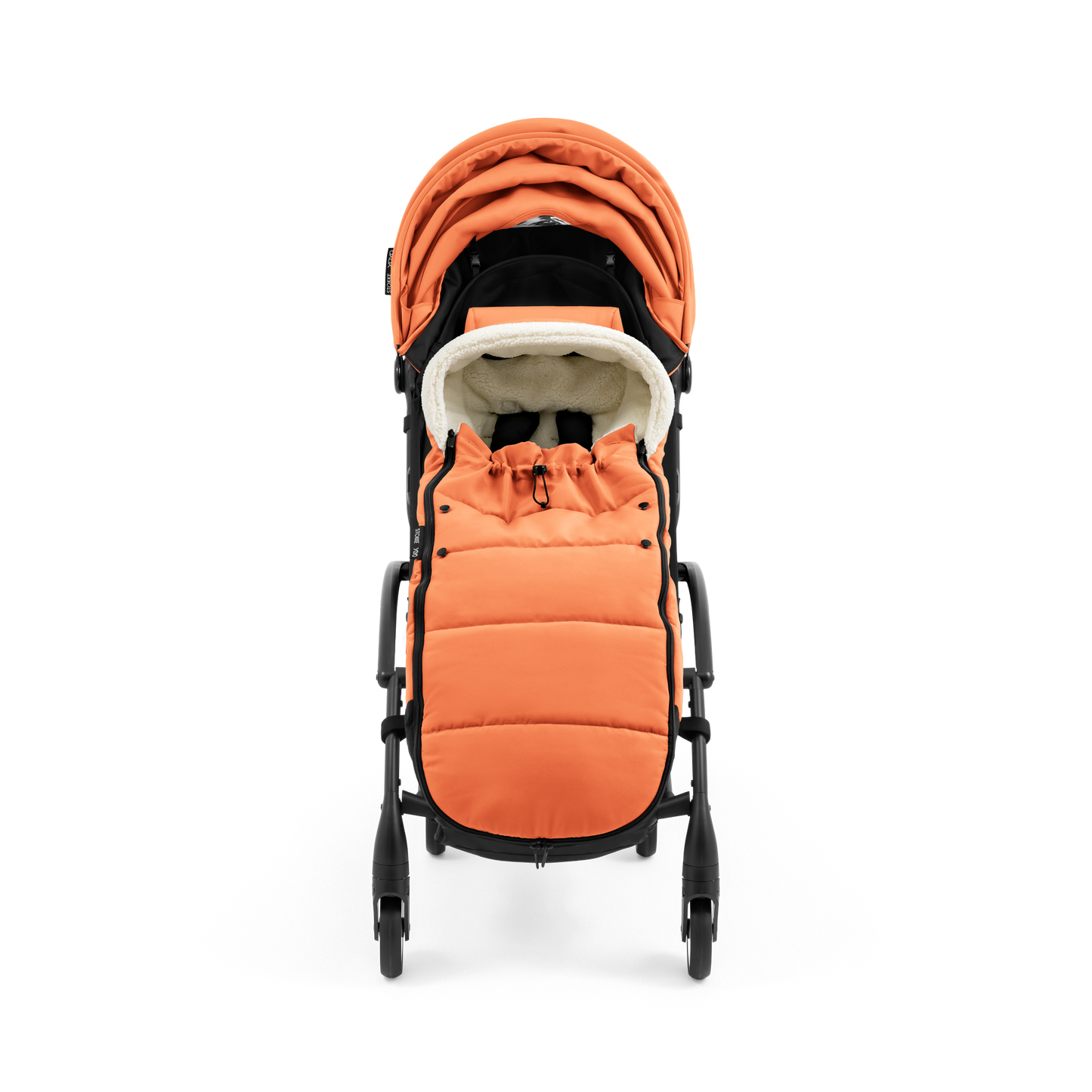 A stroller with a orange colored padded footmuff, cream fleece lining, and a black frame, shown from the front on a white background.