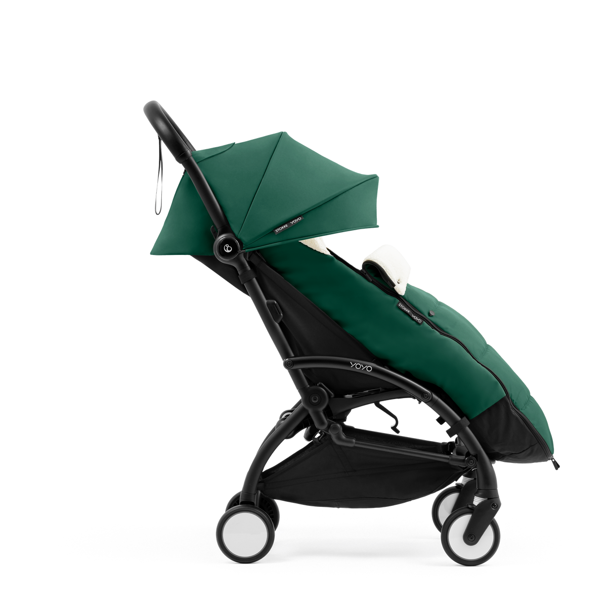 A stroller with a forest green colored padded footmuff, cream fleece lining, and a black frame, shown from the front on a white background.