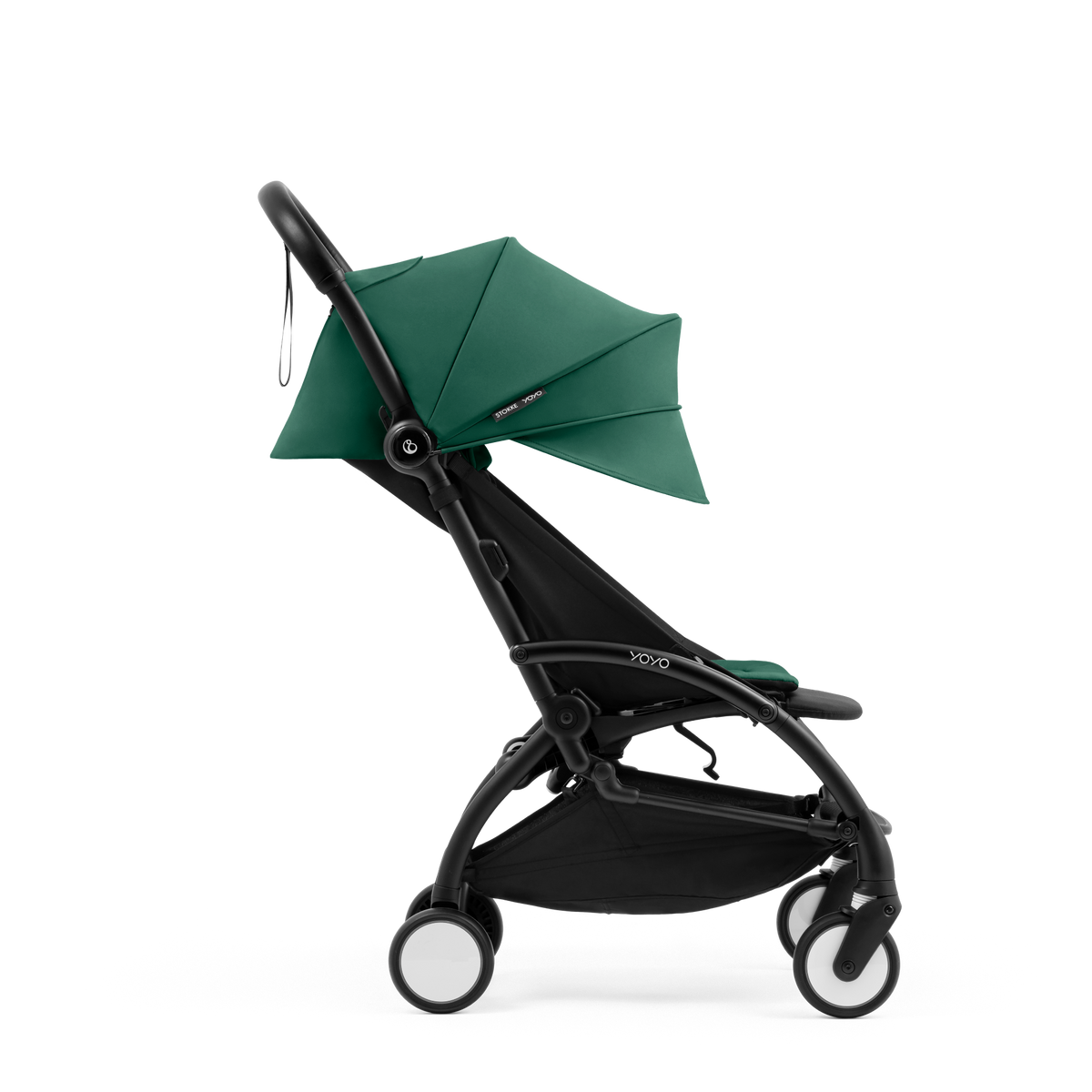 A compact yoyo 5 stroller with a green canopy and seat lining, a black frame, and black wheels, shown on a plain white background.