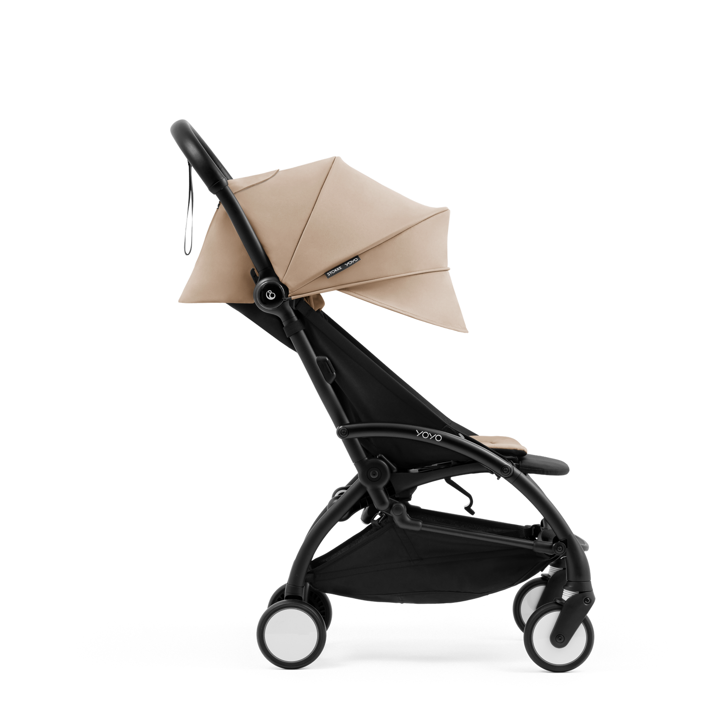 A compact yoyo 5 stroller with a beige canopy and seat lining, a black frame, and black wheels, shown on a plain white background.