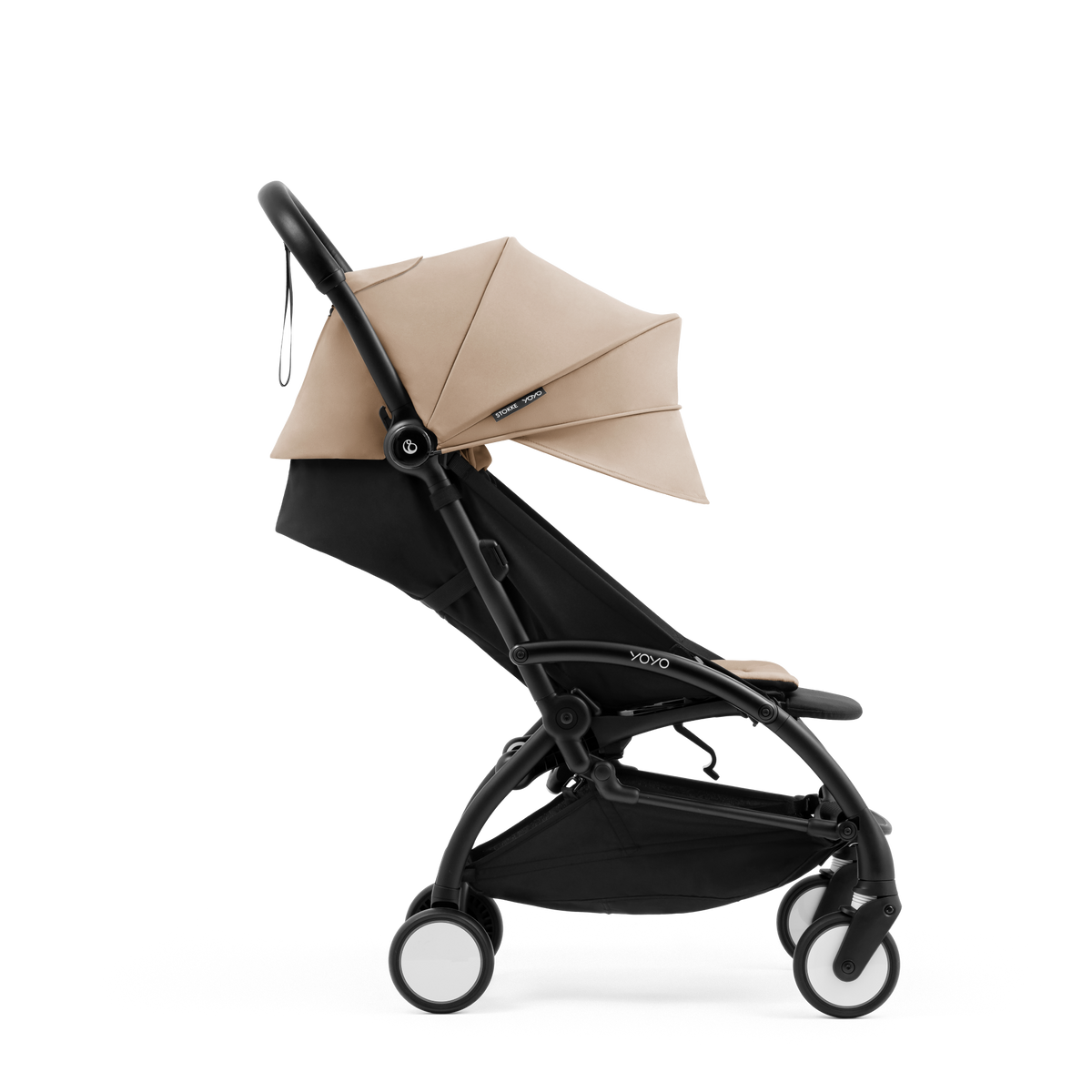 A compact yoyo 5 stroller with a beige canopy and seat lining, a black frame, and black wheels, shown on a plain white background.