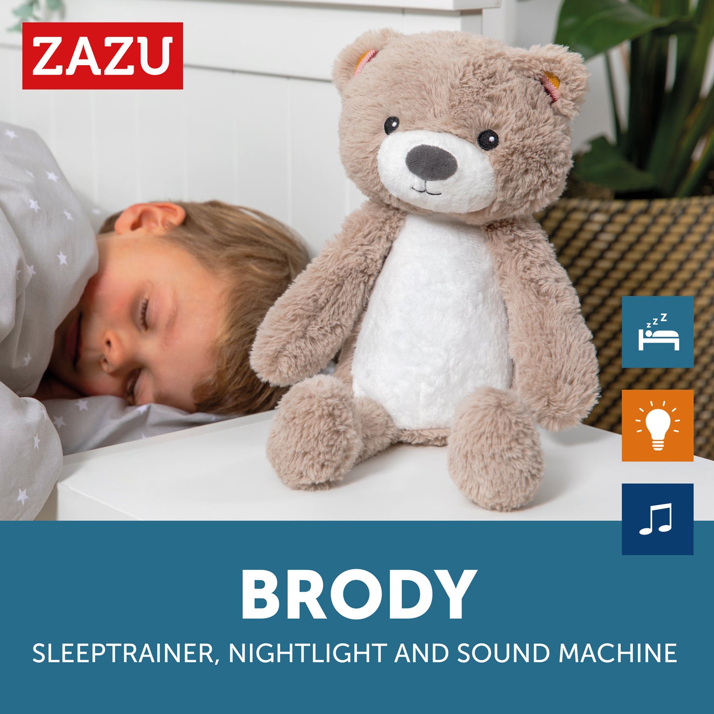 A beige and white bear called Brody with a light up belly. Sitting on a bedside locker while the toddler sleeps.