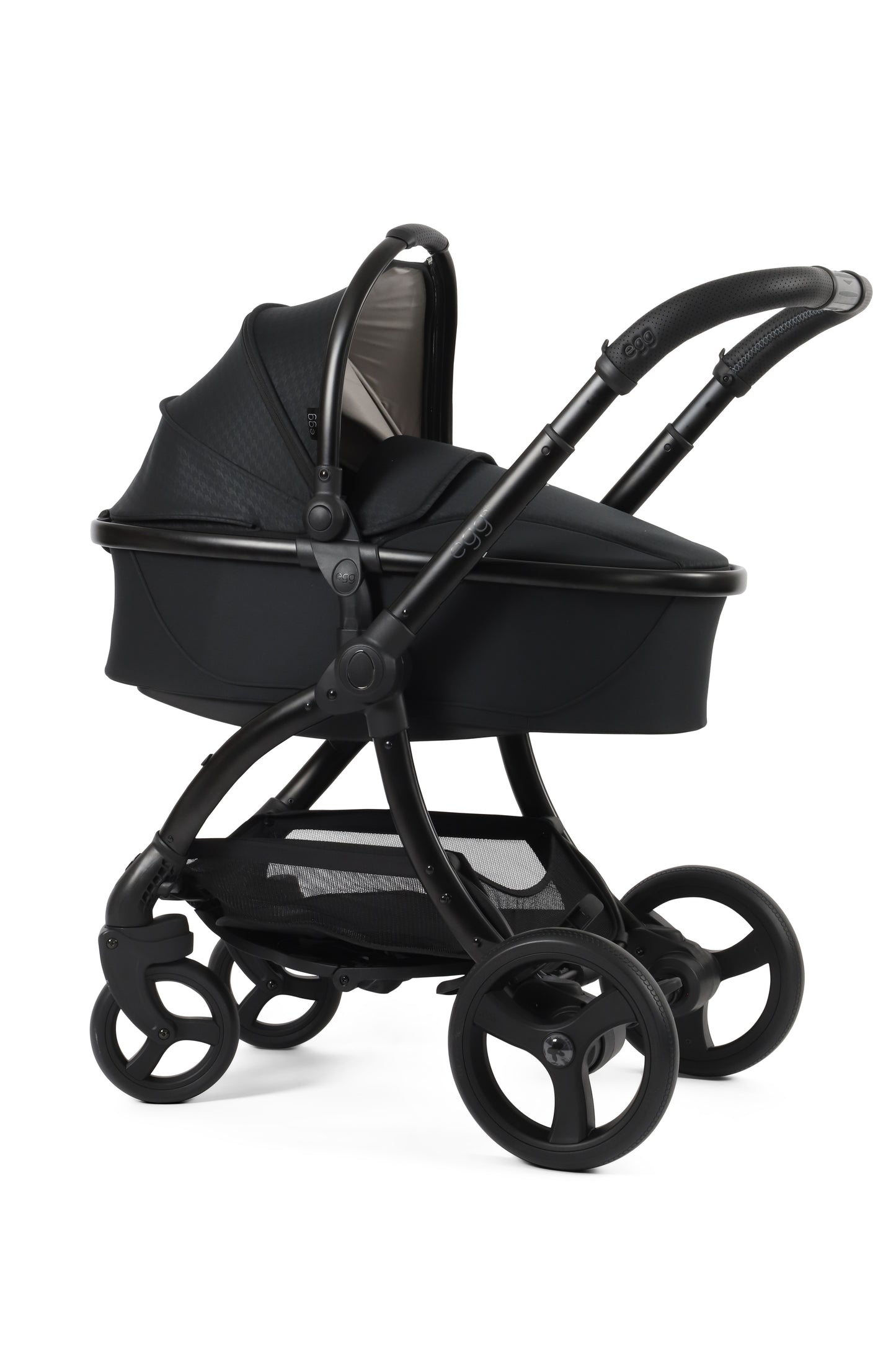 Egg 3 carrycot in houndstooth black attached to stroller