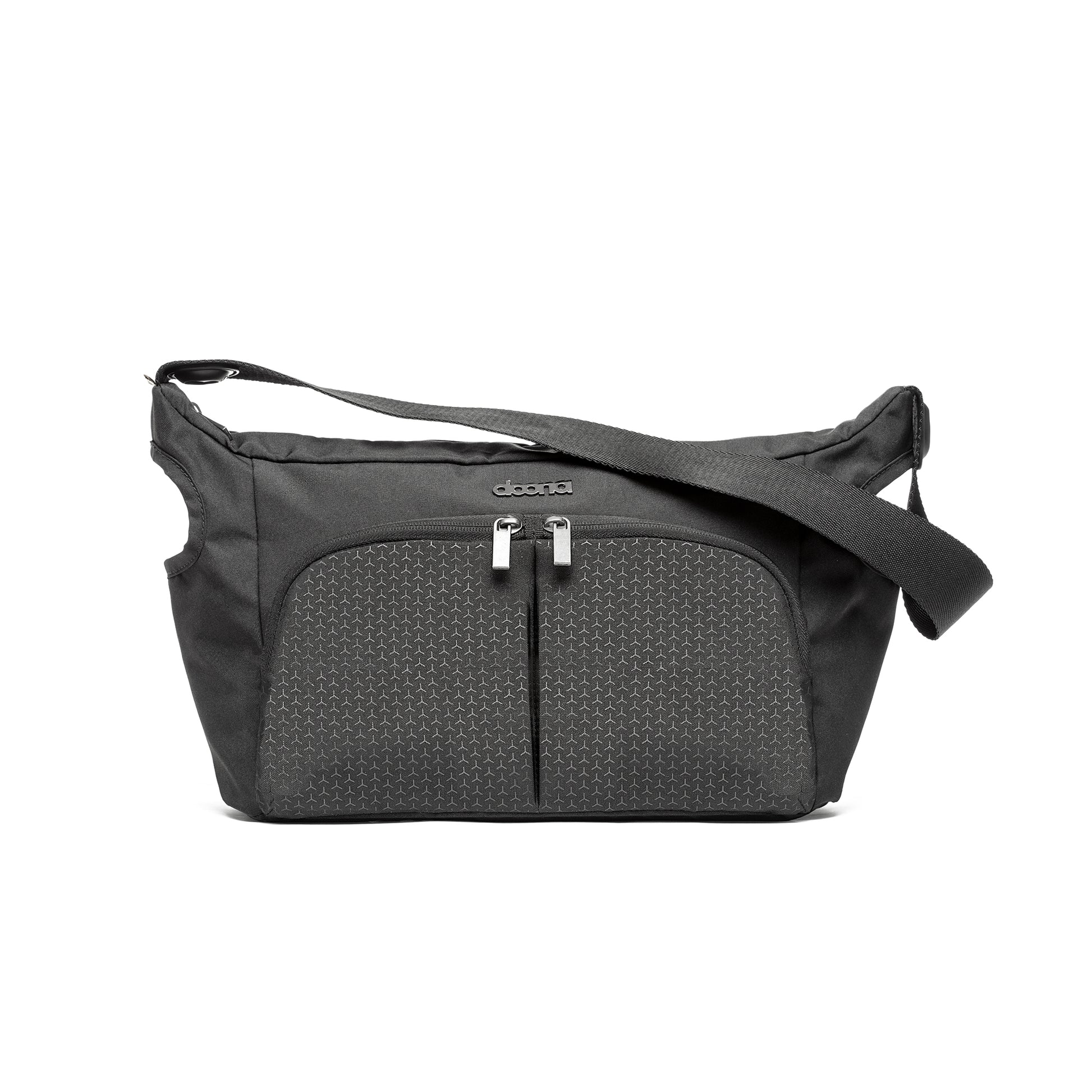 Nitro black nappy bag featuring two compartments and a zipper, ideal for organizing essentials with a Doona stroller.