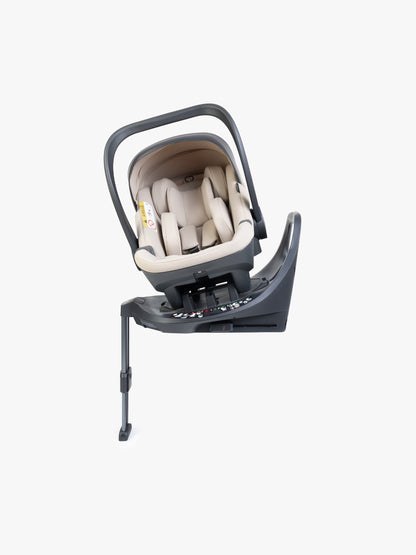 Beige baby car seat with base and ISOFIX connector on a white background