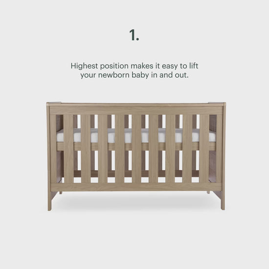 CuddleCo Burford cot bed in an oak finish.