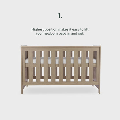 CuddleCo Burford cot bed in an oak finish.
