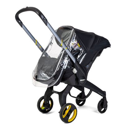 A black stroller  car seat with a clear protective cover, specifically designed for use with a Doona car seat in rainy conditions.